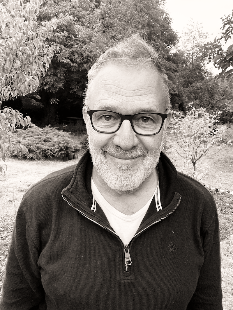 Portrait of Daniel Wagner outdoors among trees